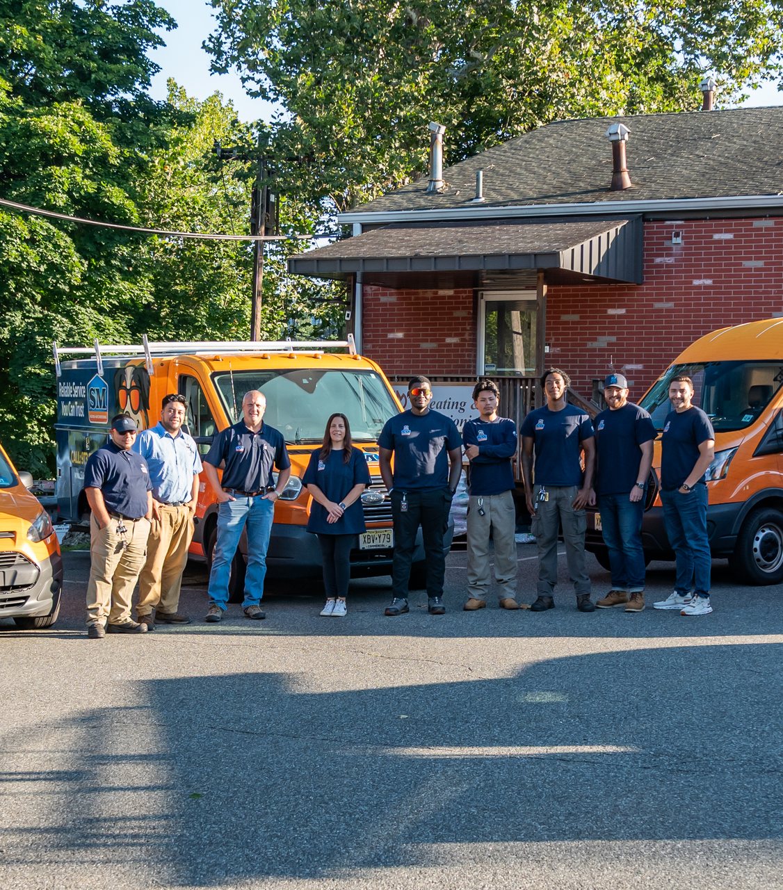 The SM Heating and Air Conditioning team in front of our Pompton Lakes shop